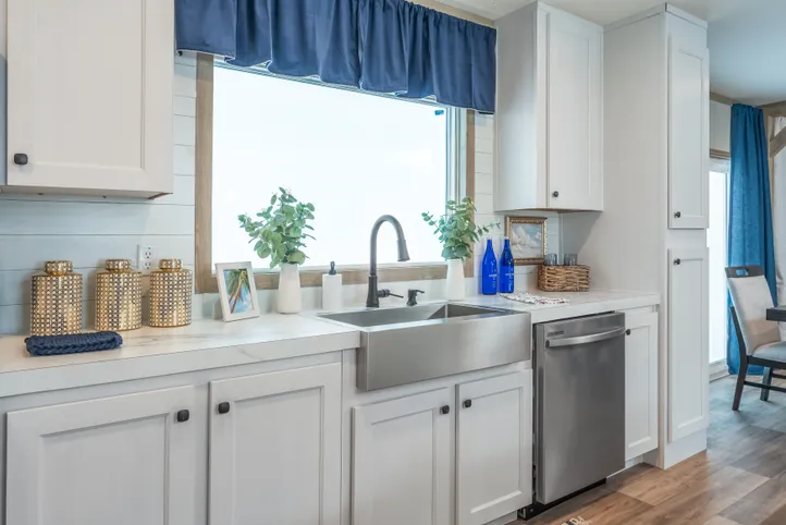 The EL SUENO BREEZE Kitchen. This Manufactured Mobile Home features 4 bedrooms and 2 baths.