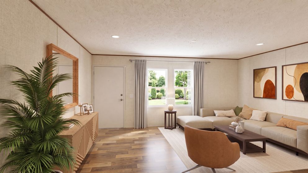 The OAK Living Room. This Manufactured Mobile Home features 4 bedrooms and 2 baths.