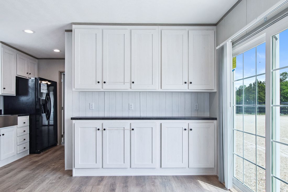 The ANNIVERSARY 16682A Kitchen. This Manufactured Mobile Home features 2 bedrooms and 2 baths.