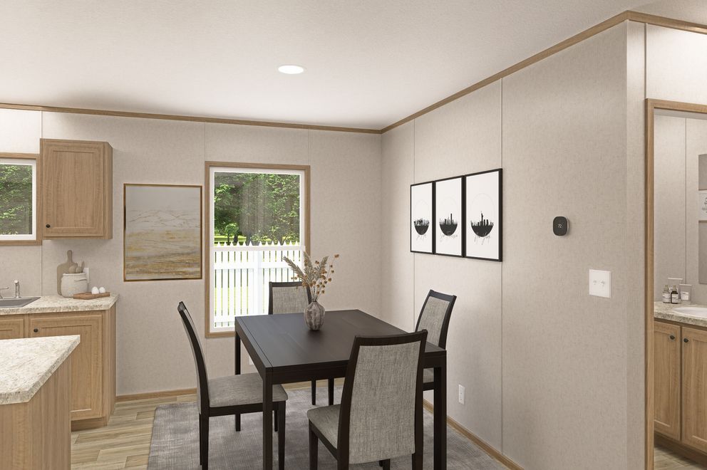 The THE EAGLE 52 Dining Area. This Manufactured Mobile Home features 3 bedrooms and 2 baths.
