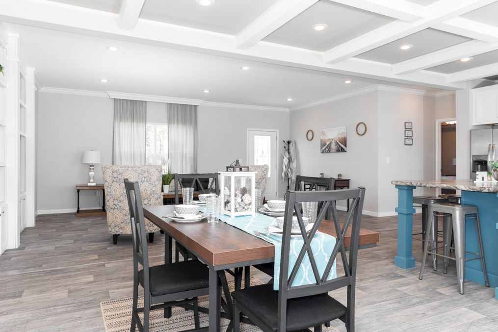 The SUPER 68 ELITE Dining Area. This Manufactured Mobile Home features 3 bedrooms and 2 baths.