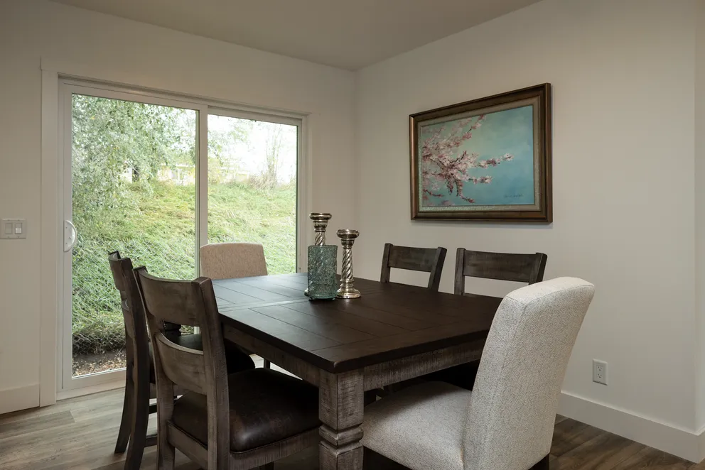 The HEY JUDE Dining Room. This Manufactured Mobile Home features 4 bedrooms and 2 baths.