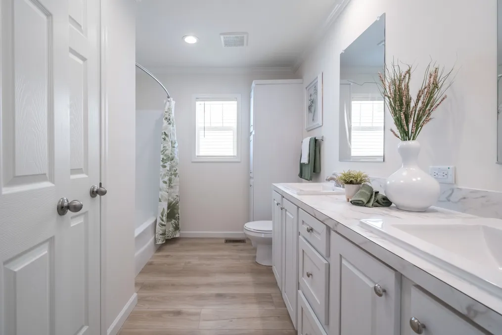 The 5430 "UWHARRIE" 7632 Guest Bathroom. This Manufactured Mobile Home features 4 bedrooms and 2 baths.