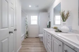 The 5430 "UWHARRIE" 7632 Guest Bathroom. This Manufactured Mobile Home features 4 bedrooms and 2 baths.