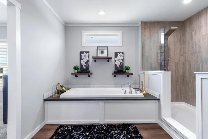 The THE CHANEL Primary Bathroom. This Manufactured Mobile Home features 4 bedrooms and 3 baths.