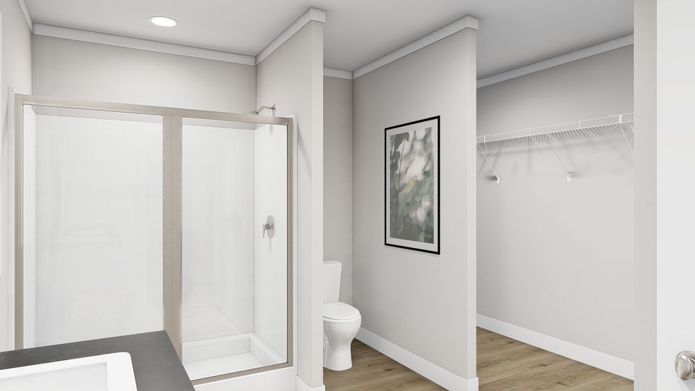 The LET IT BE Primary Bathroom. This Manufactured Mobile Home features 3 bedrooms and 2 baths.