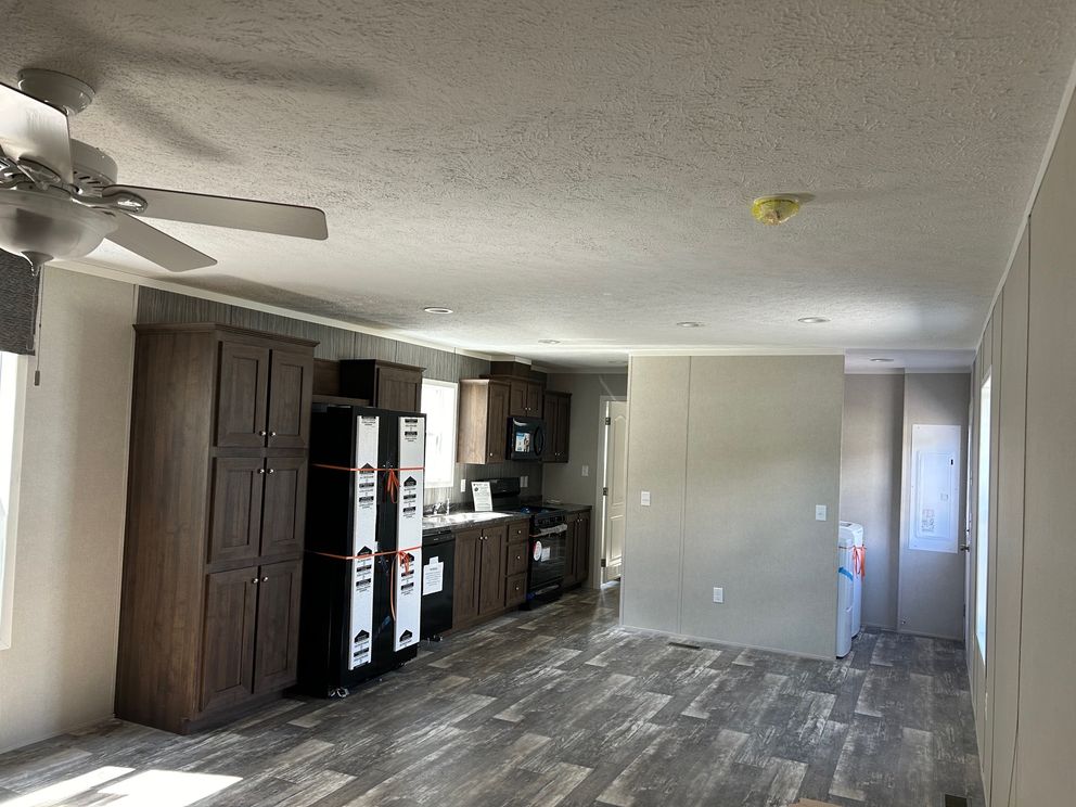 The SAPPHIRE XL 8016-644 Dining Area. This Manufactured Mobile Home features 3 bedrooms and 2 baths.