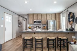 The THE WARRIOR Kitchen. This Manufactured Mobile Home features 2 bedrooms and 2 baths.