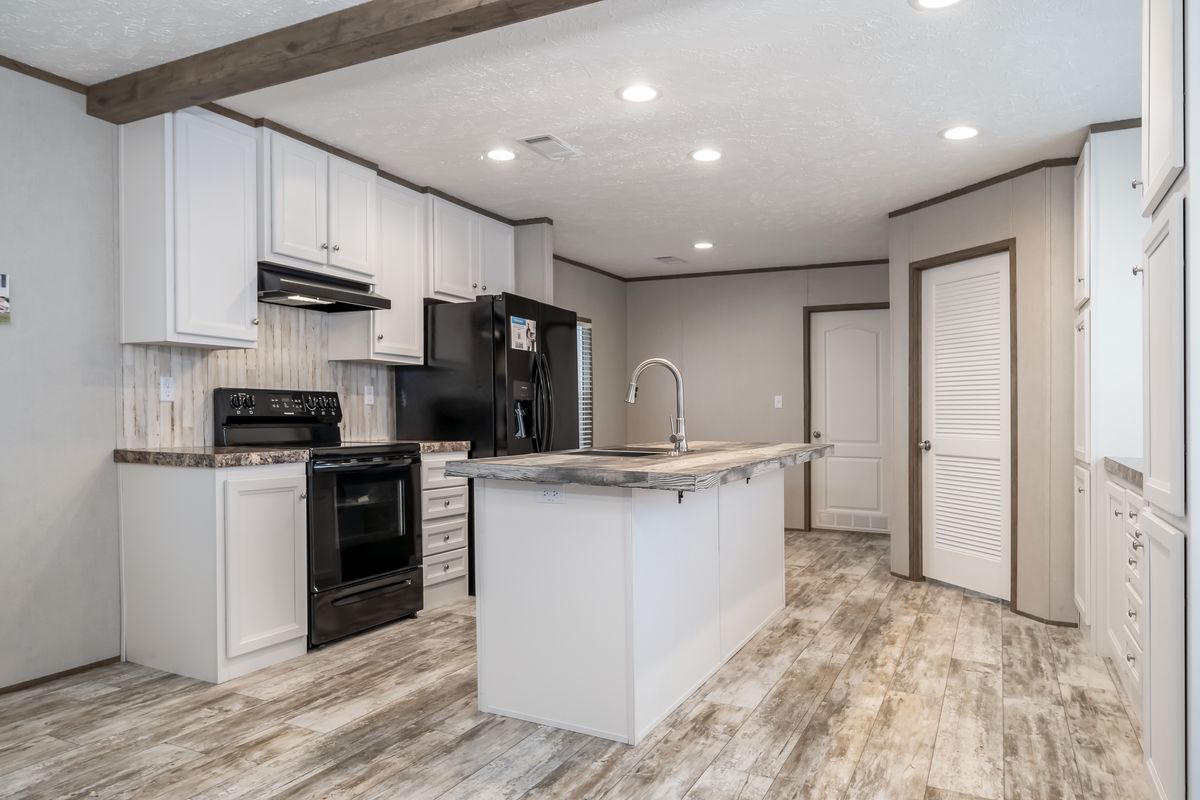 The RIVERHAVEN Exterior. This Manufactured Mobile Home features 3 bedrooms and 2 baths.