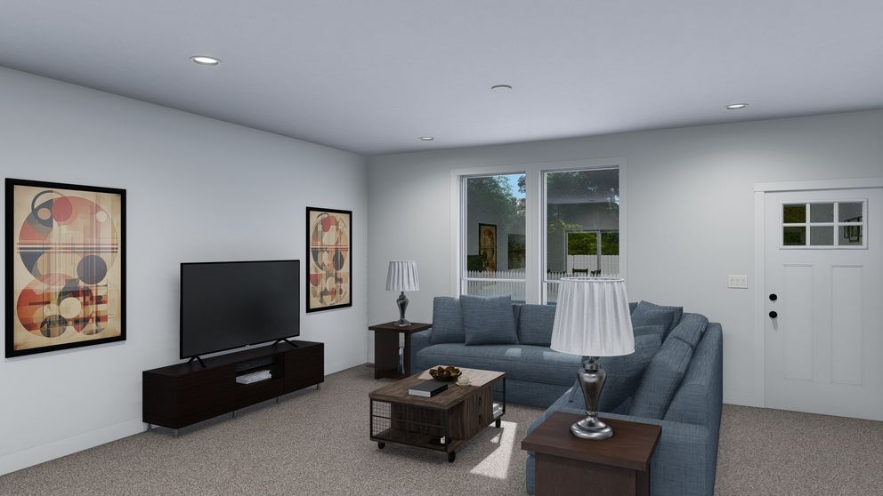 The ACADIA Living Room. This Manufactured Mobile Home features 3 bedrooms and 2 baths.