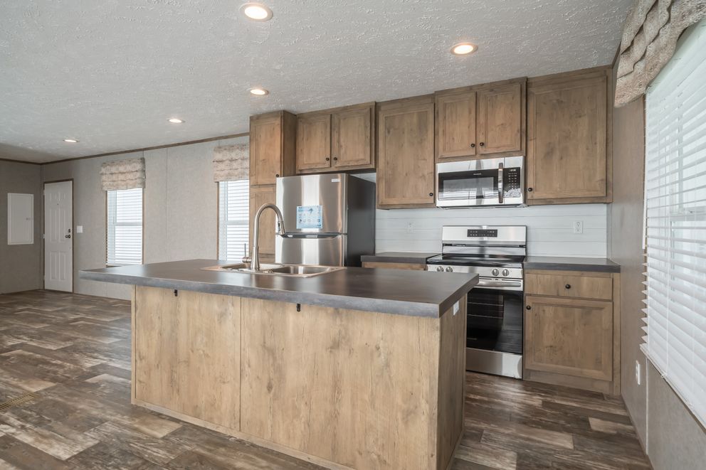 The LAKESIDE COTTAGE Kitchen. This Manufactured Mobile Home features 1 bedroom and 1 bath.