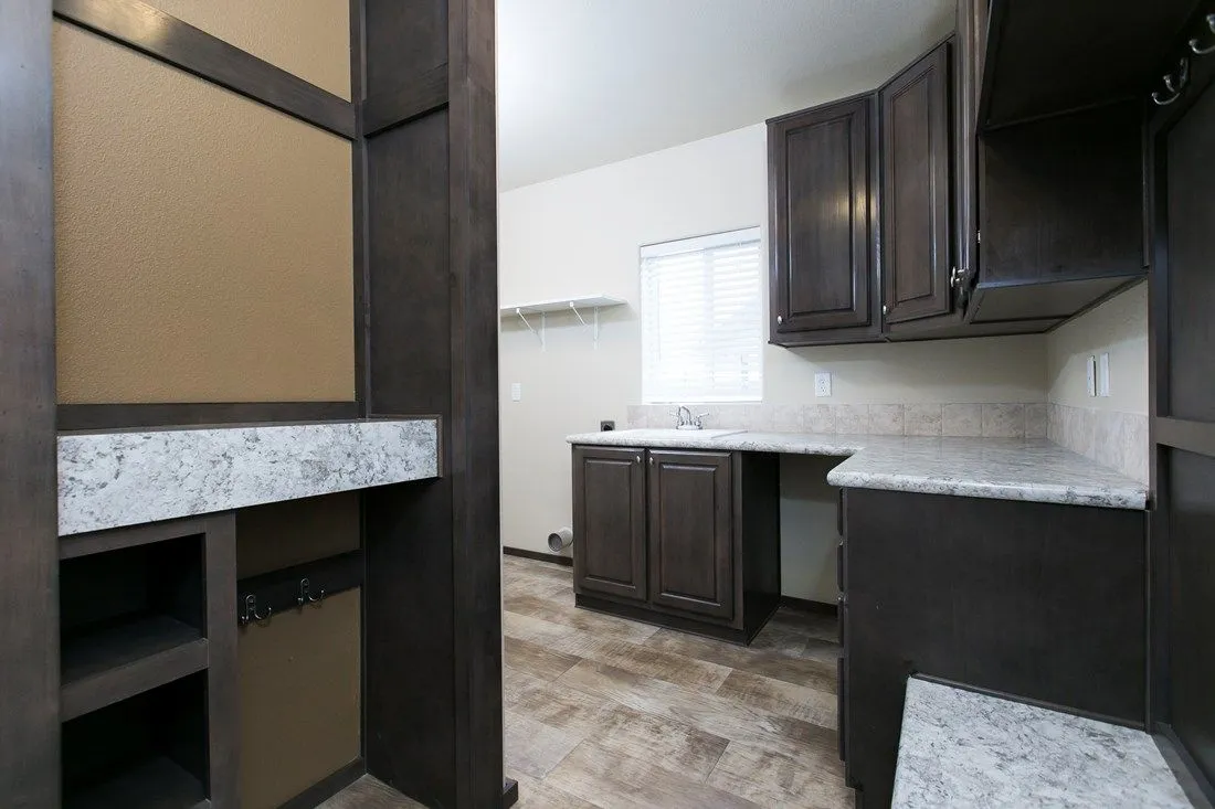 The 2023 COLUMBIA RIVER (NEW) Utility Room. This Manufactured Mobile Home features 3 bedrooms and 2 baths.