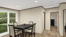 The TRIUMPH Dining Area. This Manufactured Mobile Home features 5 bedrooms and 3 baths.