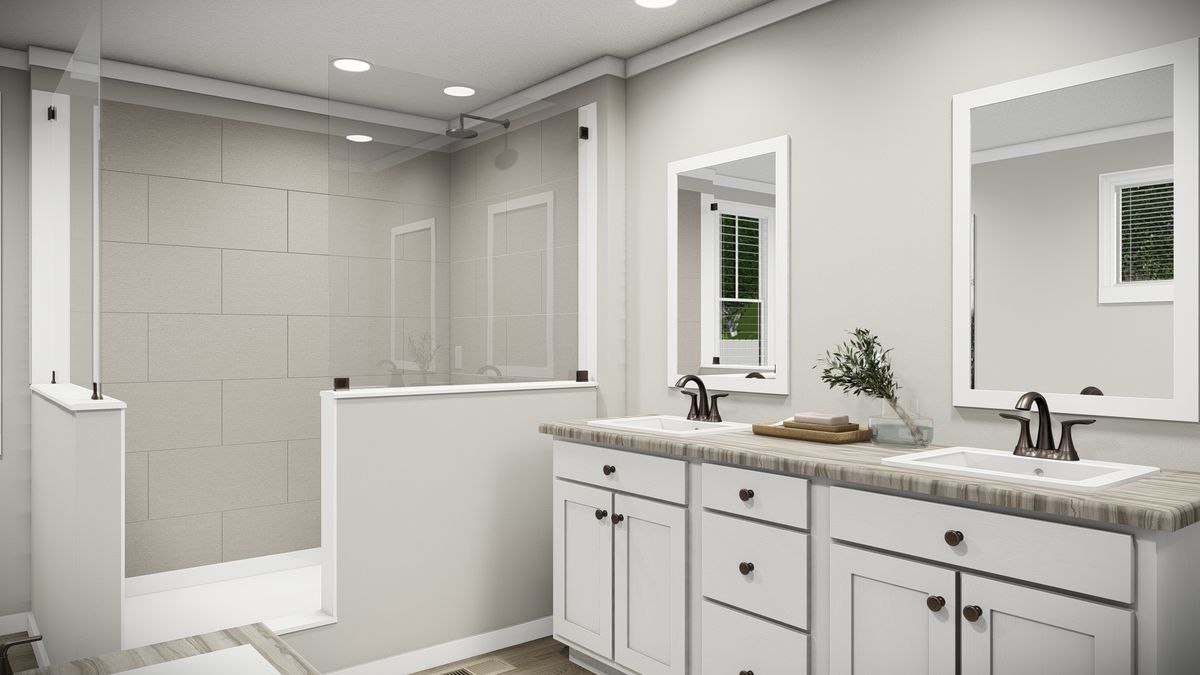 The THE REVERE Primary Bathroom. This Manufactured Mobile Home features 4 bedrooms and 2 baths.