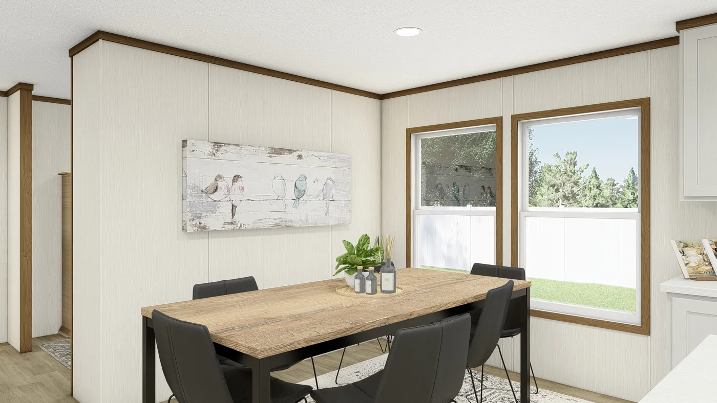 The IMPACT Dining Area. This Manufactured Mobile Home features 4 bedrooms and 2 baths.