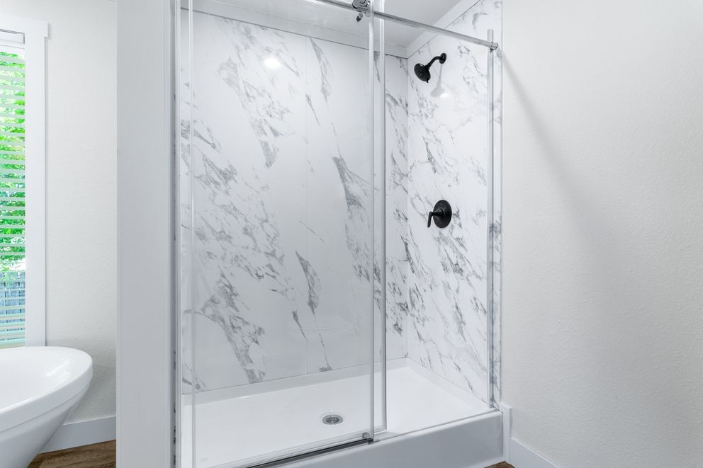 The FARM 4 FLEX ELITE Primary Bathroom. This Manufactured Mobile Home features 4 bedrooms and 3 baths.