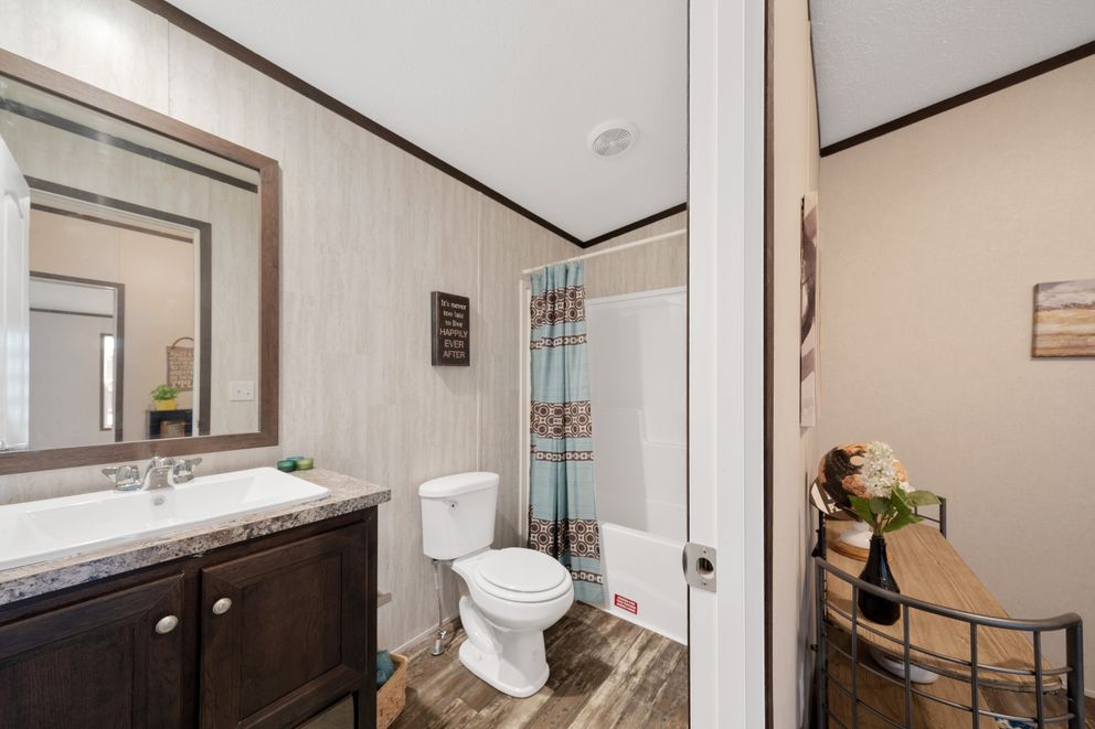 The GARNET Guest Bathroom. This Manufactured Mobile Home features 3 bedrooms and 2 baths.