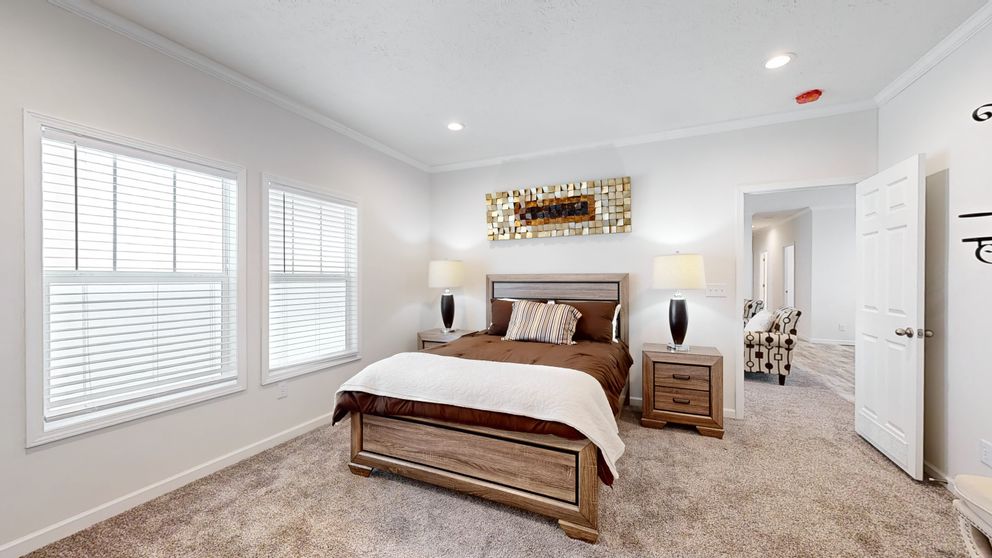 The 4872 ENTERPRISE 32X76 HUD Primary Bedroom. This Manufactured Mobile Home features 4 bedrooms and 2 baths.