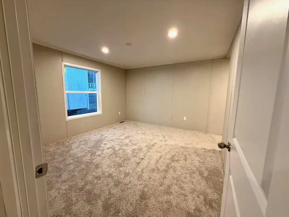 The JASPER 4428-638 Guest Bedroom. This Manufactured Mobile Home features 2 bedrooms and 2 baths.