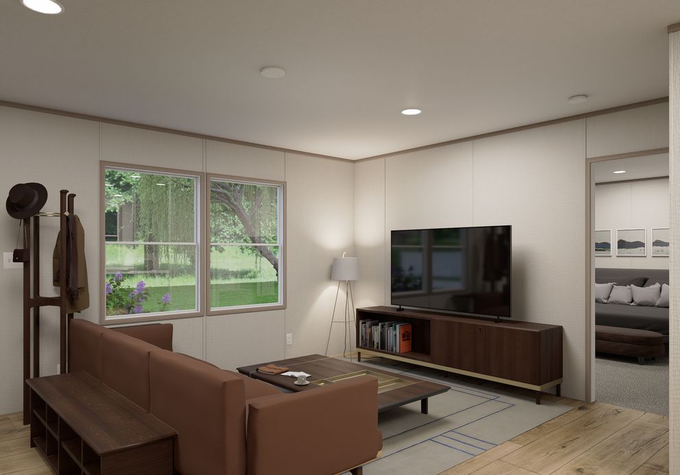 The ULTRA FLEX Living Room. This Manufactured Mobile Home features 4 bedrooms and 2 baths.