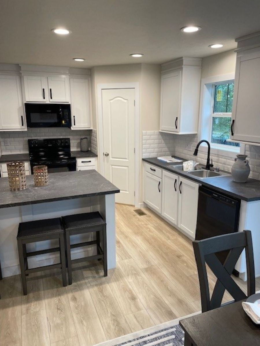 The MICHIGAN AVE/6028-MS026-1 SECT Kitchen. This Manufactured Mobile Home features 3 bedrooms and 2 baths.