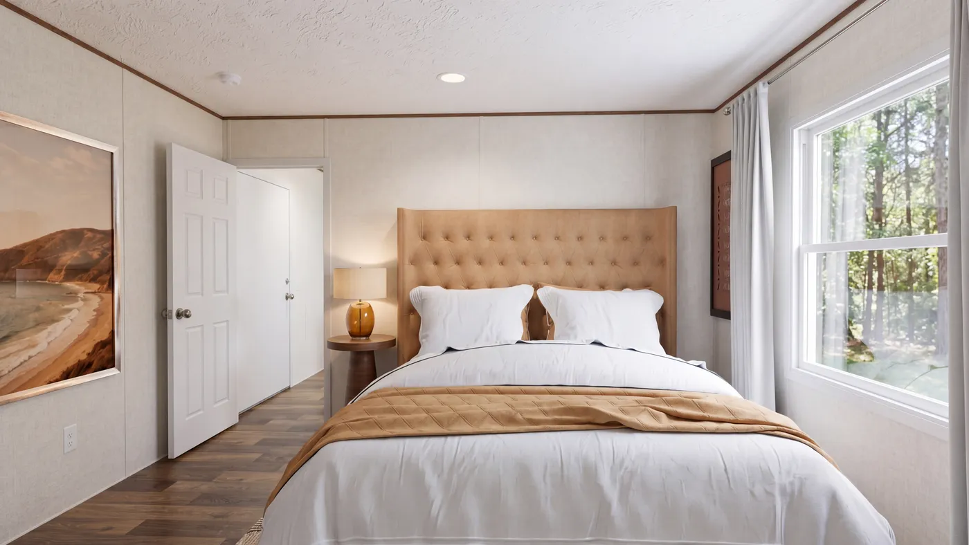 The HICKORY Primary Bedroom. This Manufactured Mobile Home features 3 bedrooms and 2 baths.