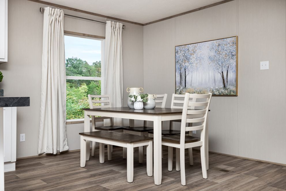 The ASPIRE Dining Area. This Manufactured Mobile Home features 3 bedrooms and 2 baths.
