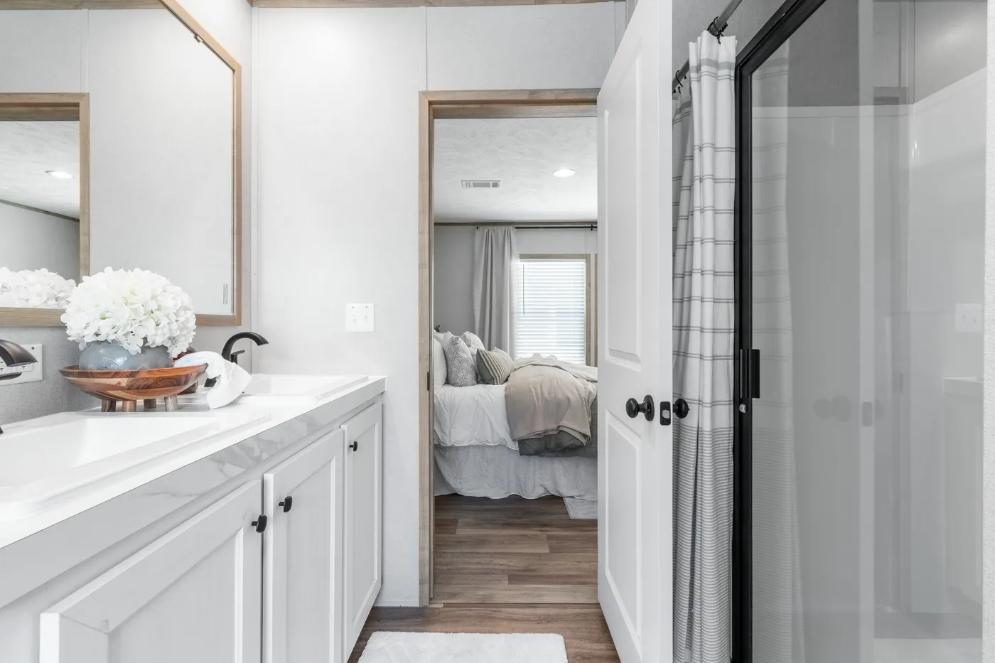 The THE REAL DEAL Primary Bathroom. This Manufactured Mobile Home features 3 bedrooms and 2 baths.