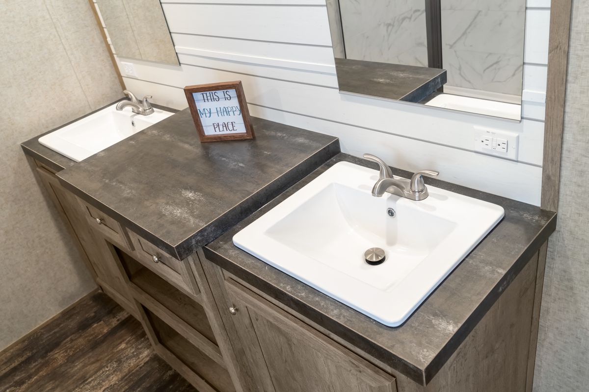The MAJOR Primary Bathroom. This Manufactured Mobile Home features 3 bedrooms and 2 baths.