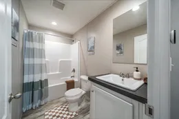 The BENJAMIN Guest Bathroom. This Manufactured Mobile Home features 3 bedrooms and 2 baths.