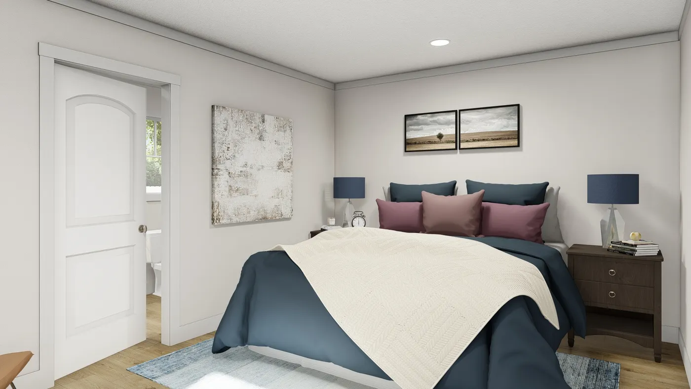 The MOVE ON UP Primary Bedroom. This Manufactured Mobile Home features 3 bedrooms and 2 baths.