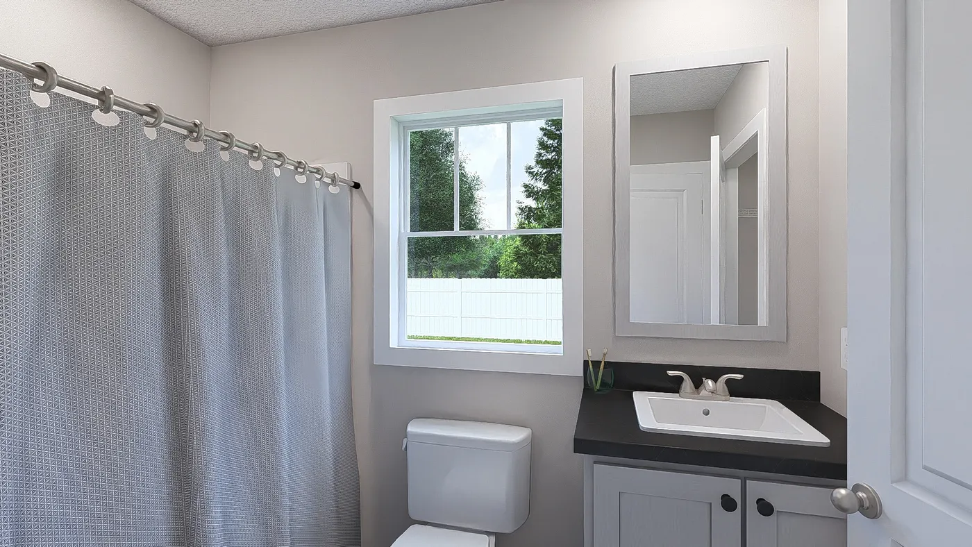 The YESTERDAY Primary Bathroom. This Manufactured Mobile Home features 1 bedroom and 1 bath.