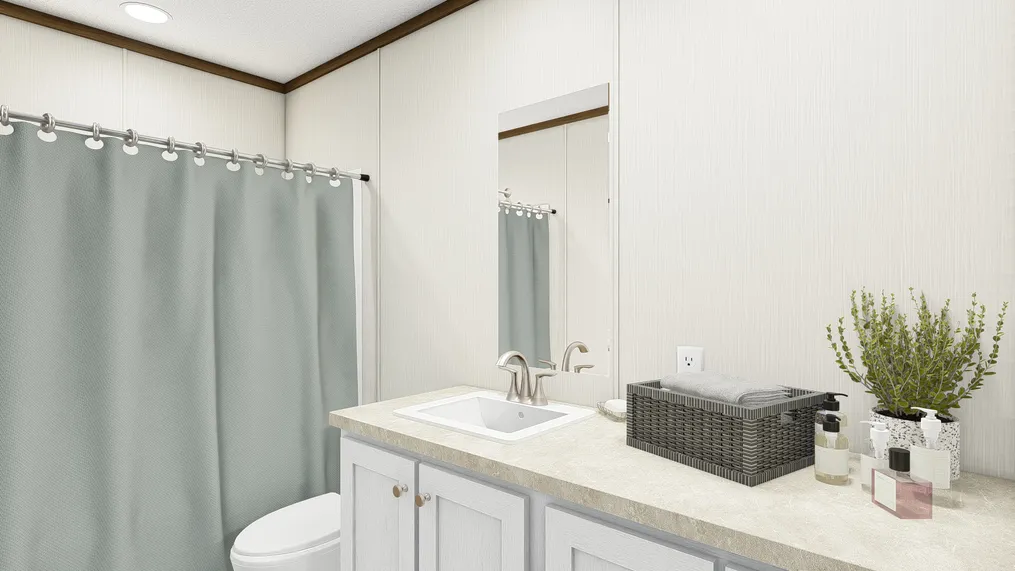 The THE DISCOVER Guest Bathroom. This Manufactured Mobile Home features 3 bedrooms and 2 baths.