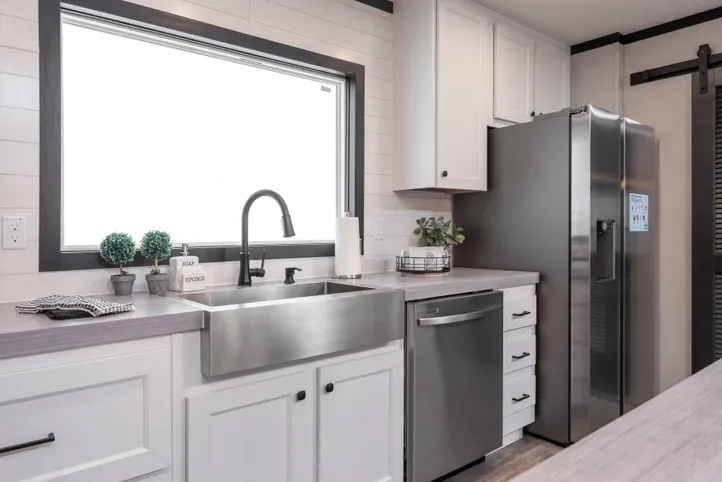 The BREEZE FARMHOUSE Kitchen. This Manufactured Mobile Home features 3 bedrooms and 2 baths.