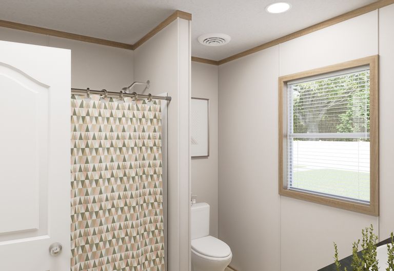The THE MOUNTAINEER 72 Guest Bathroom. This Manufactured Mobile Home features 3 bedrooms and 2 baths.