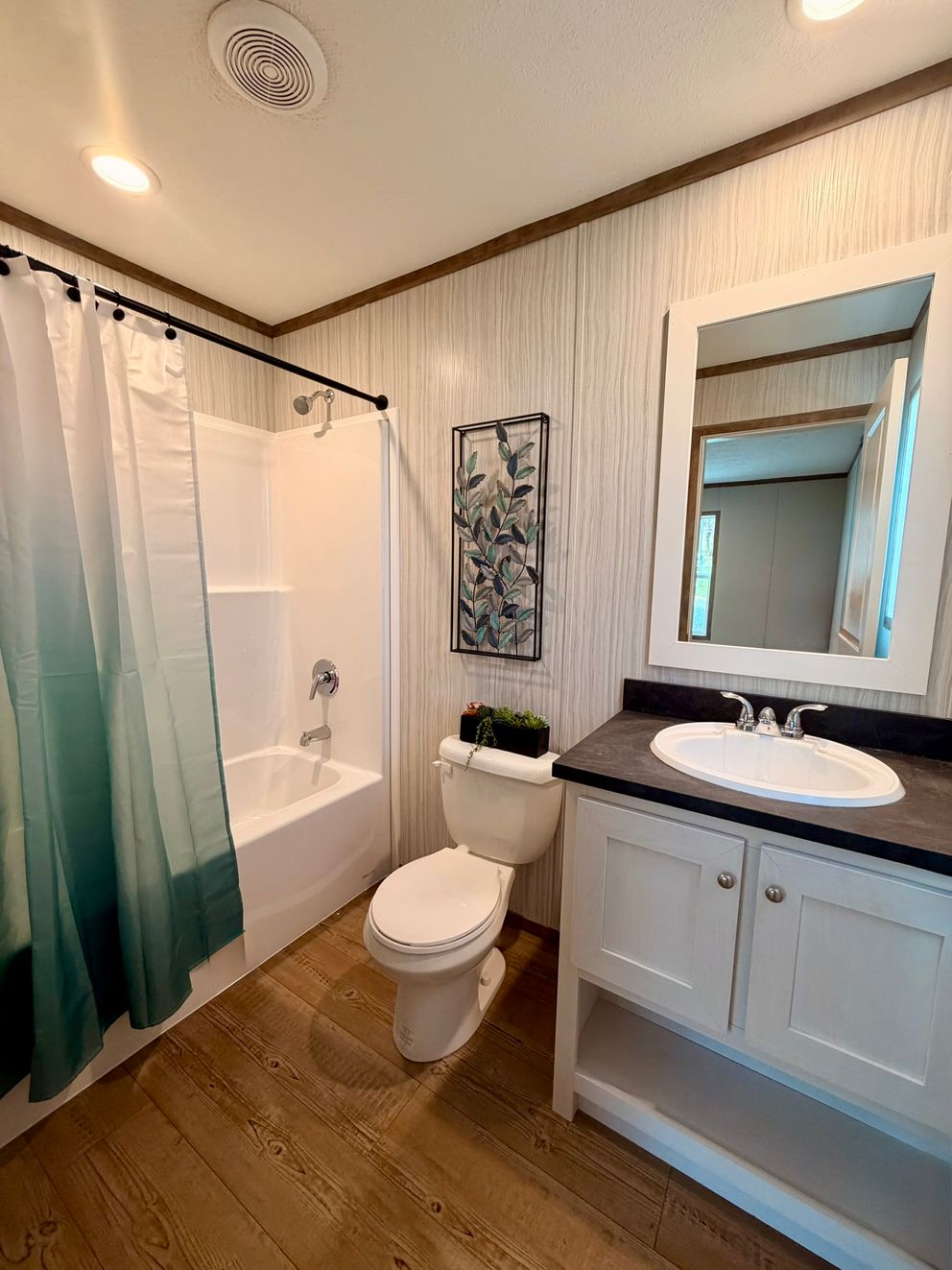 The APATITE Guest Bathroom. This Manufactured Mobile Home features 3 bedrooms and 2 baths.