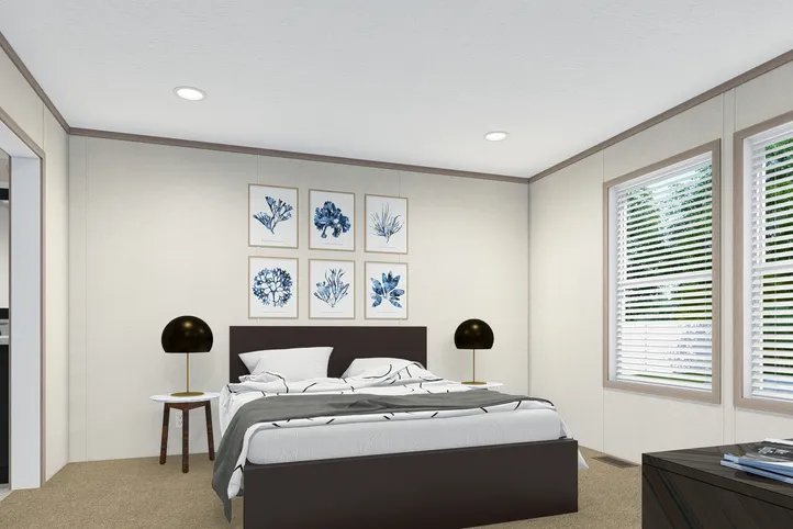 The 5628-E787 THE PULSE Primary Bedroom. This Manufactured Mobile Home features 3 bedrooms and 2 baths.