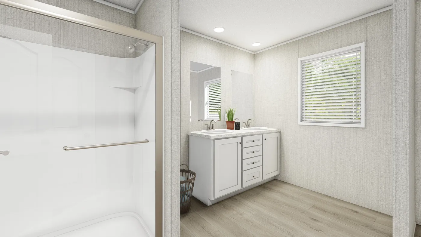 The COASTAL BREEZE II 28X56 Primary Bathroom. This Manufactured Mobile Home features 3 bedrooms and 2 baths.
