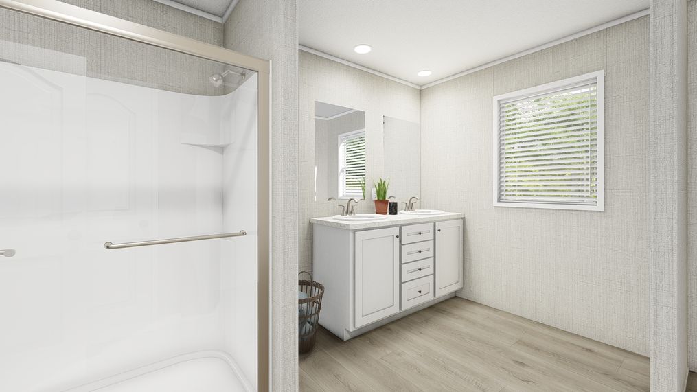 The COASTAL BREEZE II 28X56 Primary Bathroom. This Manufactured Mobile Home features 3 bedrooms and 2 baths.