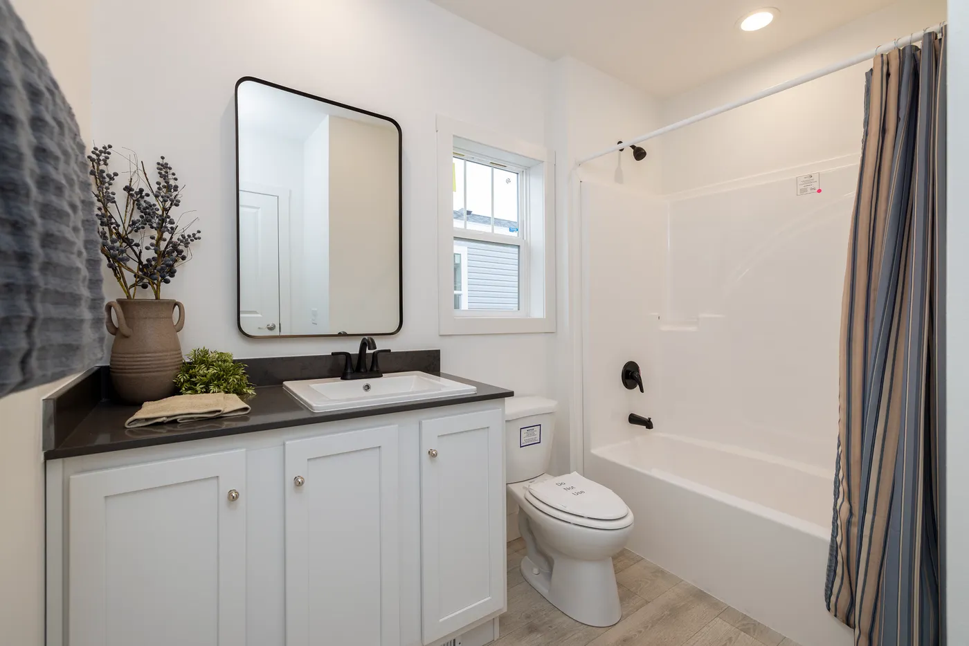 The WINSTON Guest Bathroom. This Manufactured Mobile Home features 3 bedrooms and 2 baths.