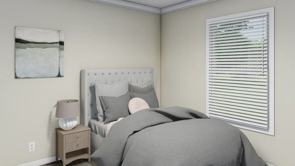 The CAROLINIAN M5010 Bedroom. This Manufactured Mobile Home features 3 bedrooms and 2 baths.