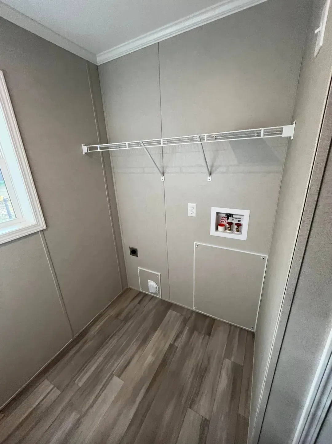 The PERIDOT 60 Utility Room. This Manufactured Mobile Home features 2 bedrooms and 2 baths.