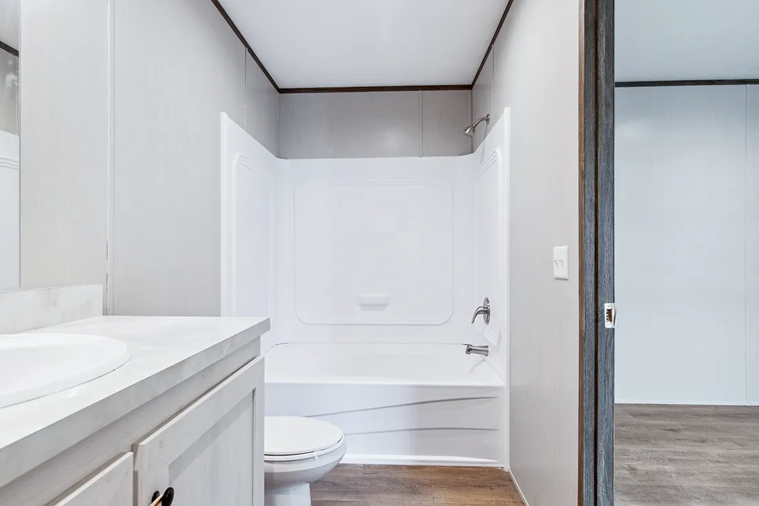 The HOMESTEAD 16562A Primary Bathroom. This Manufactured Mobile Home features 2 bedrooms and 2 baths.