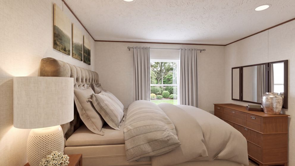 The ELM Primary Bedroom. This Manufactured Mobile Home features 2 bedrooms and 1 bath.