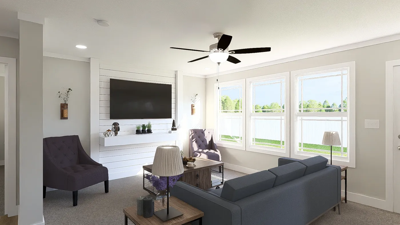The THE BREEZE 64 Living Room. This Manufactured Mobile Home features 4 bedrooms and 2 baths.