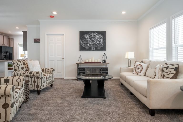 The 4872 ENTERPRISE 32X76 HUD Living Room. This Manufactured Mobile Home features 4 bedrooms and 2 baths.