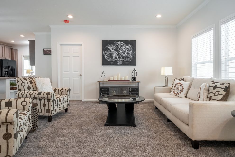 The 4872 ENTERPRISE 32X76 HUD Living Room. This Manufactured Mobile Home features 4 bedrooms and 2 baths.