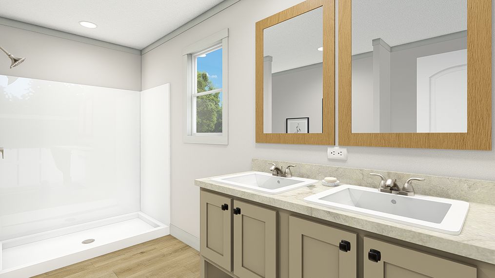 The FREE BIRD Primary Bathroom. This Manufactured Mobile Home features 3 bedrooms and 2 baths.