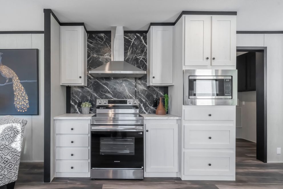 The LIL SOUTHERN CHARM Kitchen. This Manufactured Mobile Home features 3 bedrooms and 2 baths.