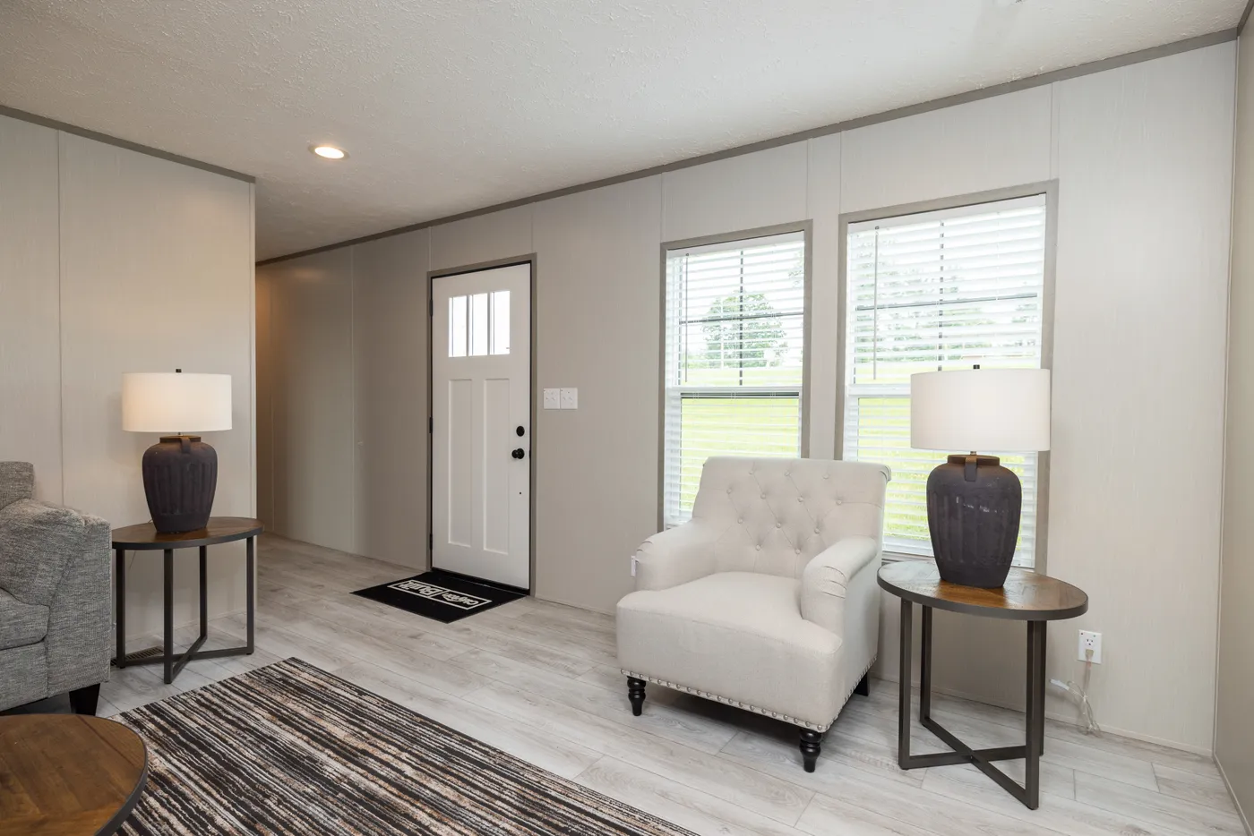 The SHOWER HOUSE Living Room. This Manufactured Mobile Home features 3 bedrooms and 2 baths.
